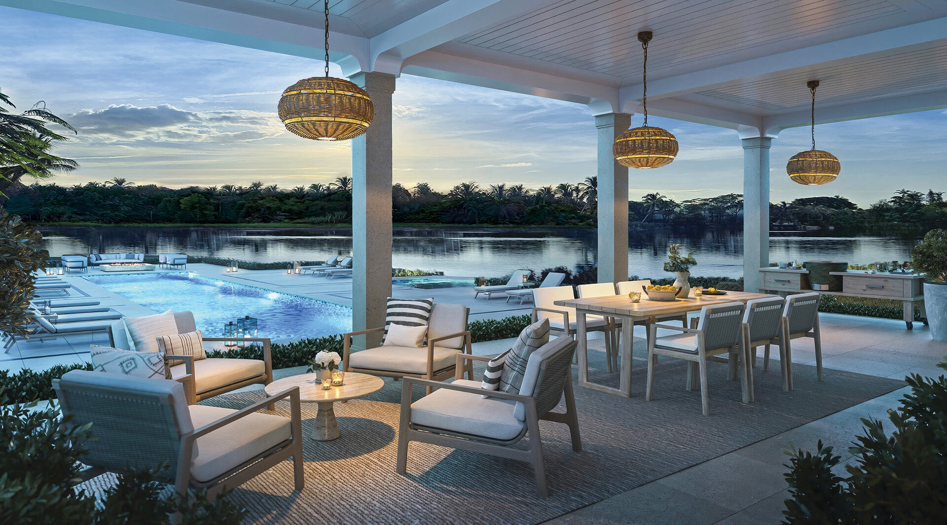 Close-up of dark green velvet dining chairs around a white table with decorative accents